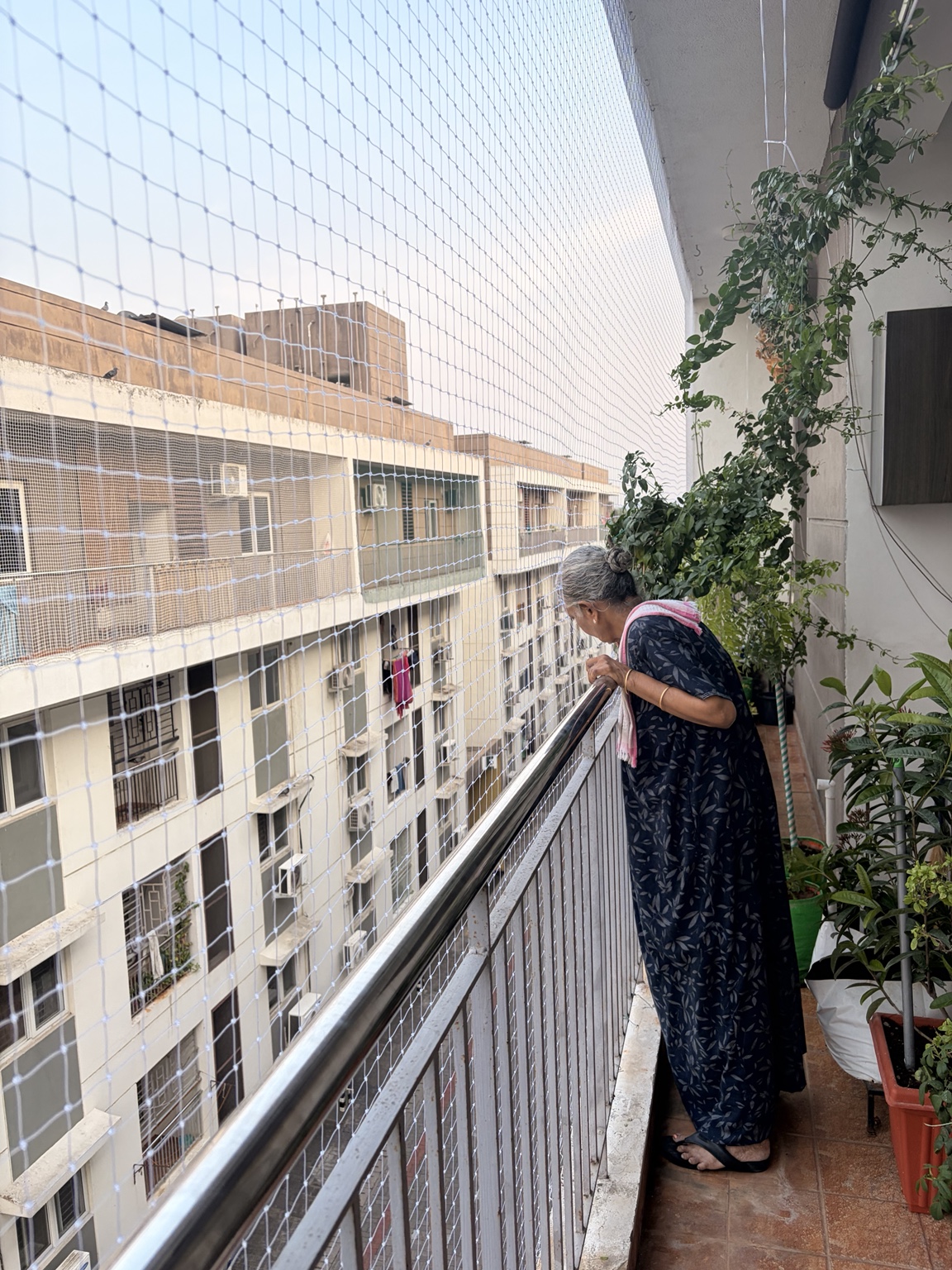 White netting fitted across a residential balcony