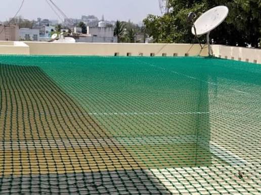 Green netting stretched across a large open area